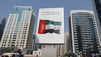 A poster in the marina reads 'UAE a Nation for Humanity'. Dubai Marina, Dubai. Chris Whiteoak / The National