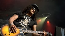 Collectors pay good money to have a guitar that looks like it's been on tour with Guns N' Roses guitarist Slash. Photo: Redferns