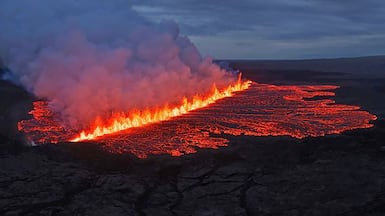 Handout picture released on July 16, 2025 by the Public Defense Department of the State Police Commissioner in Iceland shows lava and smoke erupting from a volcano near Grindavik on the Icelandic peninsula of Reykjanes. A volcano erupted on Wednesday in Iceland's Reykjanes peninsula in the southwest, weather authorities said, the ninth eruption to hit the region since the end of 2023. Broadcaster RUV reported that the nearby fishing village Grindavik had been evacuated, as had the Blue Lagoon, Iceland's famed tourist spot. (Photo by Icelandic Department of Civil Protection and Emergency Management / Public Defense Department of the State Police / AFP) / RESTRICTED TO EDITORIAL USE - MANDATORY CREDIT "AFP PHOTO / Public Defense Department of the State Police in Iceland" - NO MARKETING NO ADVERTISING CAMPAIGNS - DISTRIBUTED AS A SERVICE TO CLIENTS
