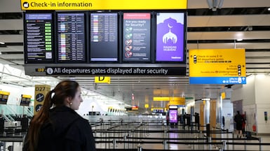 A departure board displaying cancelled flights to Middle East countries at London Heathrow Airport. Reuters