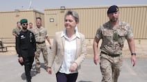 Foreign Secretary Yvette Cooper with members of a British military detachment near Riyadh. PA